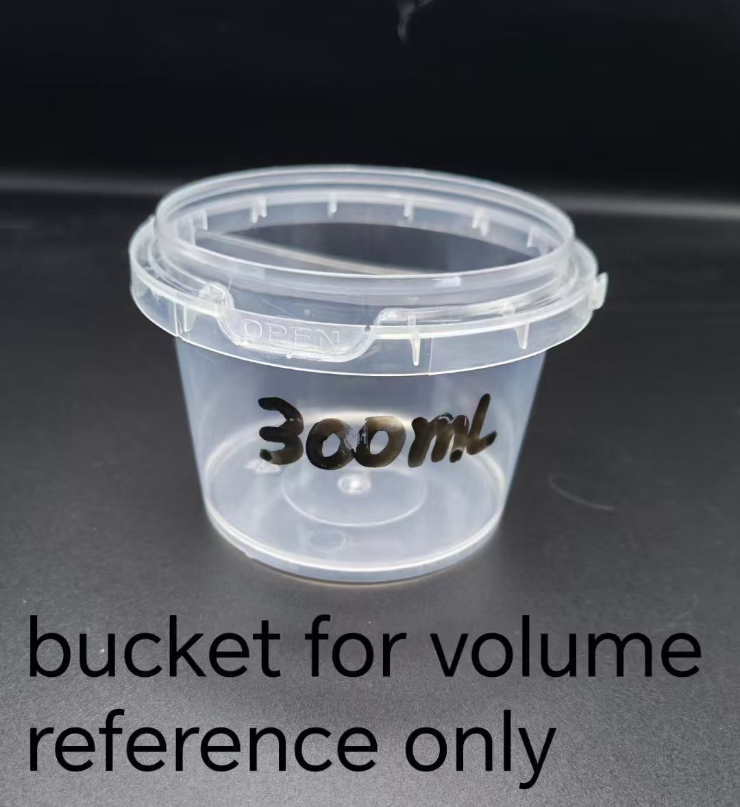 Empty 300 milliliter bucket used only as a volume reference