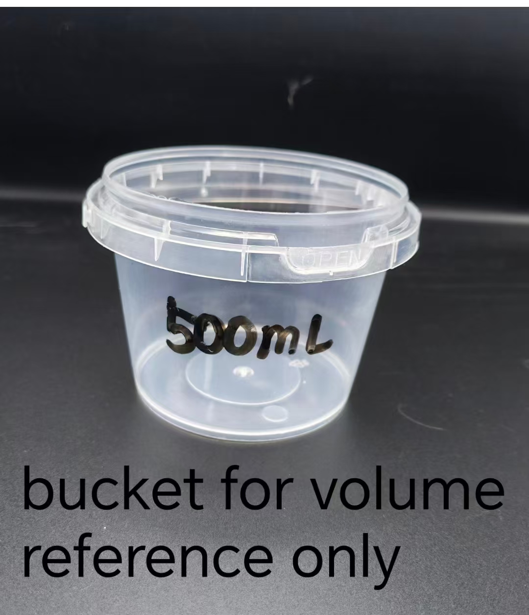 Empty 500 milliliter bucket used only as a volume reference