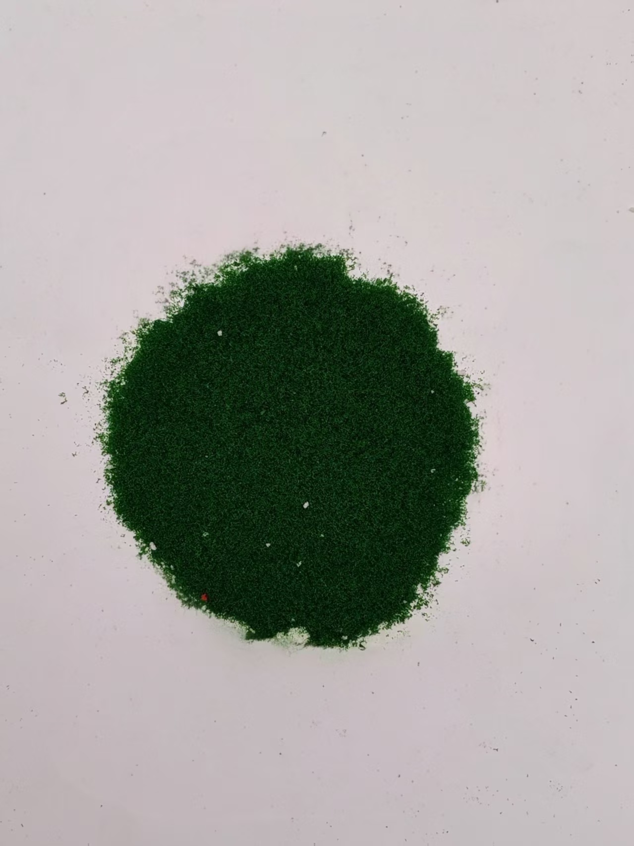 Green material spread out to show its color and texture