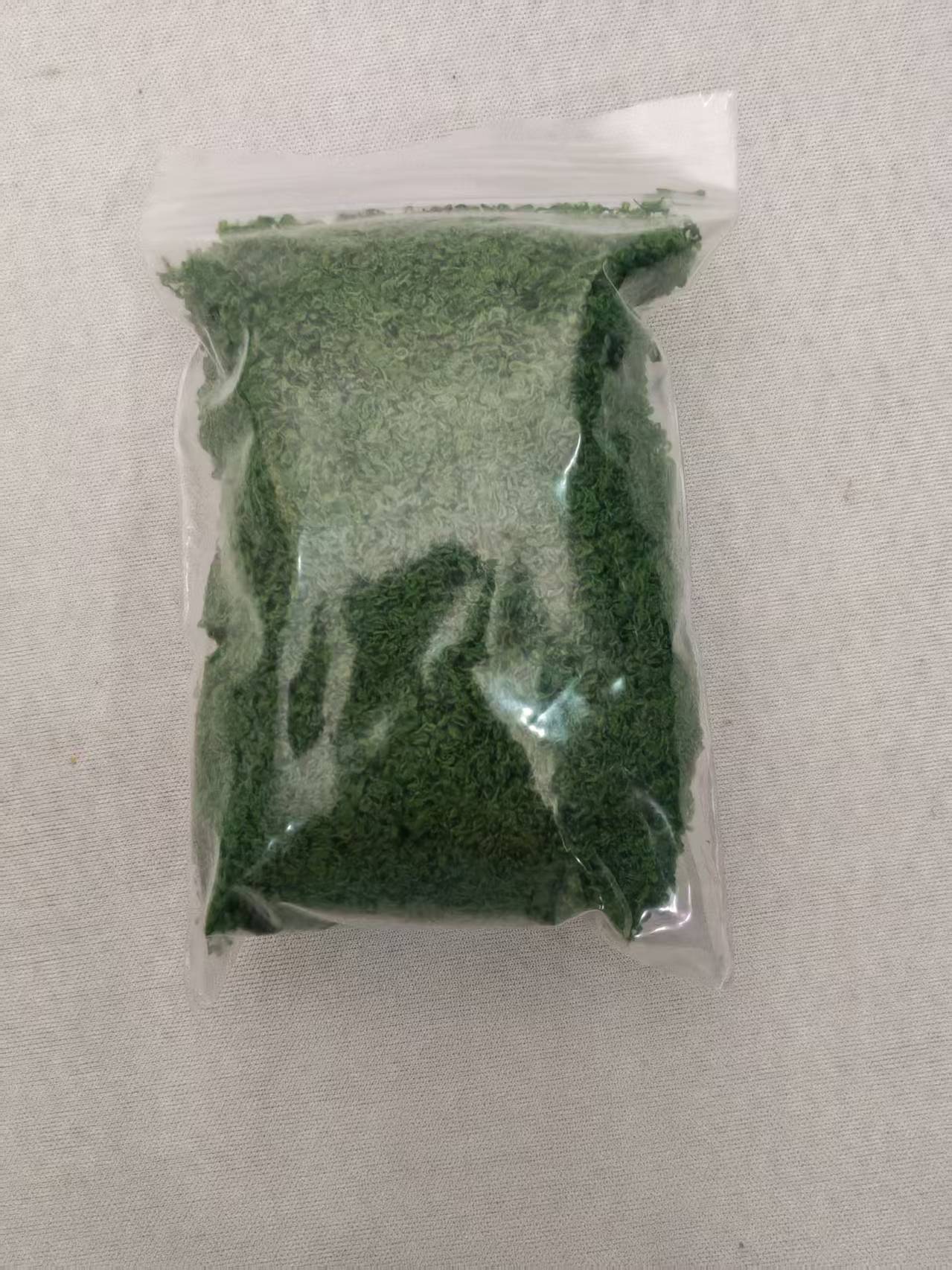 Dark Green Moss material in its sale bag